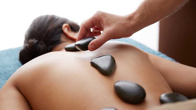 Visit Divine Day Spa for a heavenly hot stone massage - A top to toe indulgence to relieve aching bodies.